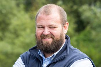 Adam Godwin stood smiling
